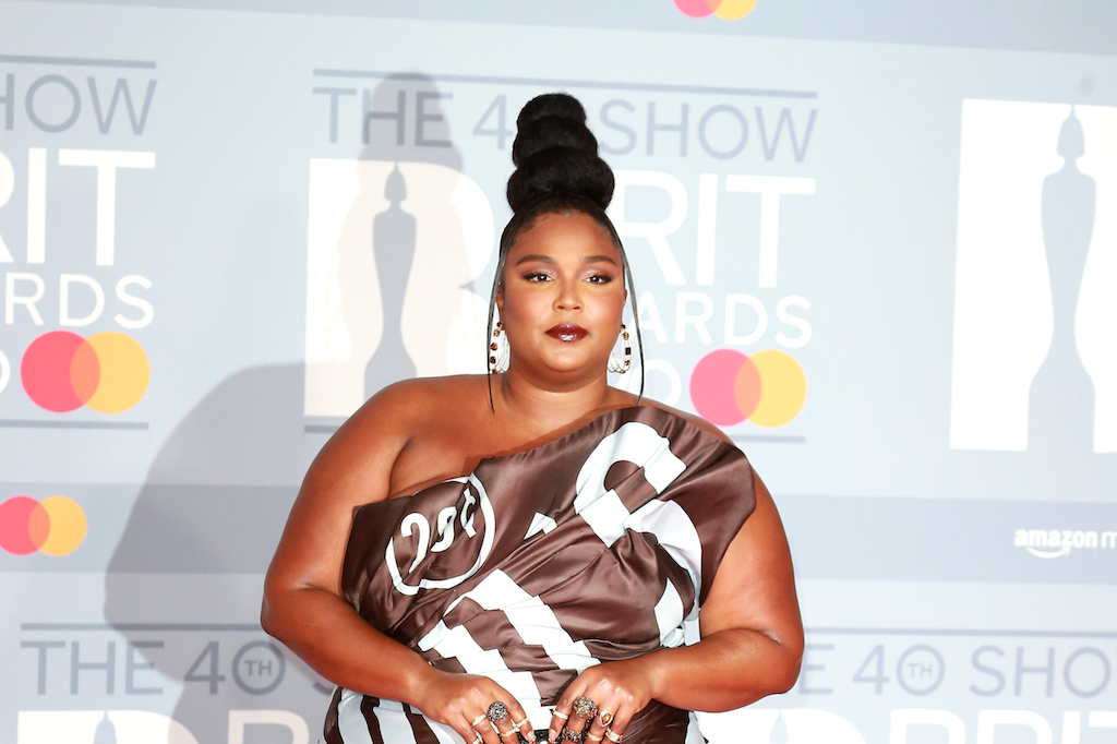 Lizzo Shines in a Gold Sequined Look and Combat Boots