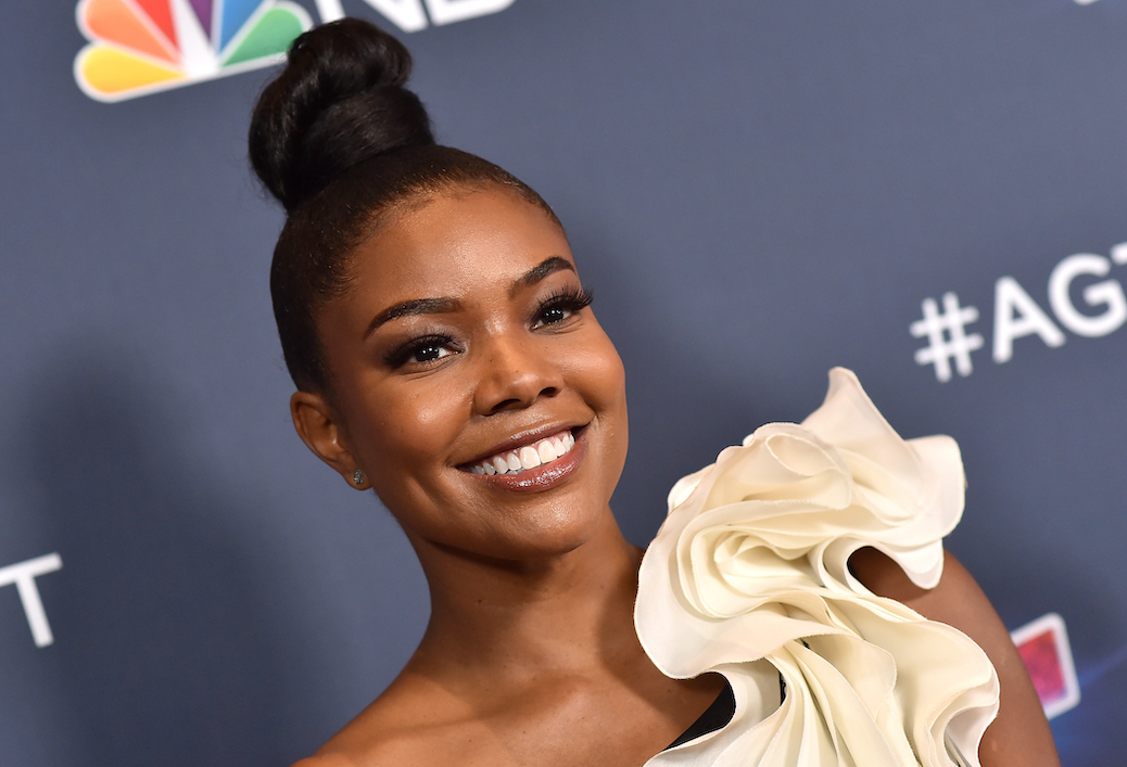 Gabrielle Union Dazzles in a Black and Silver Midi Dress With  Coordinating Stilettos